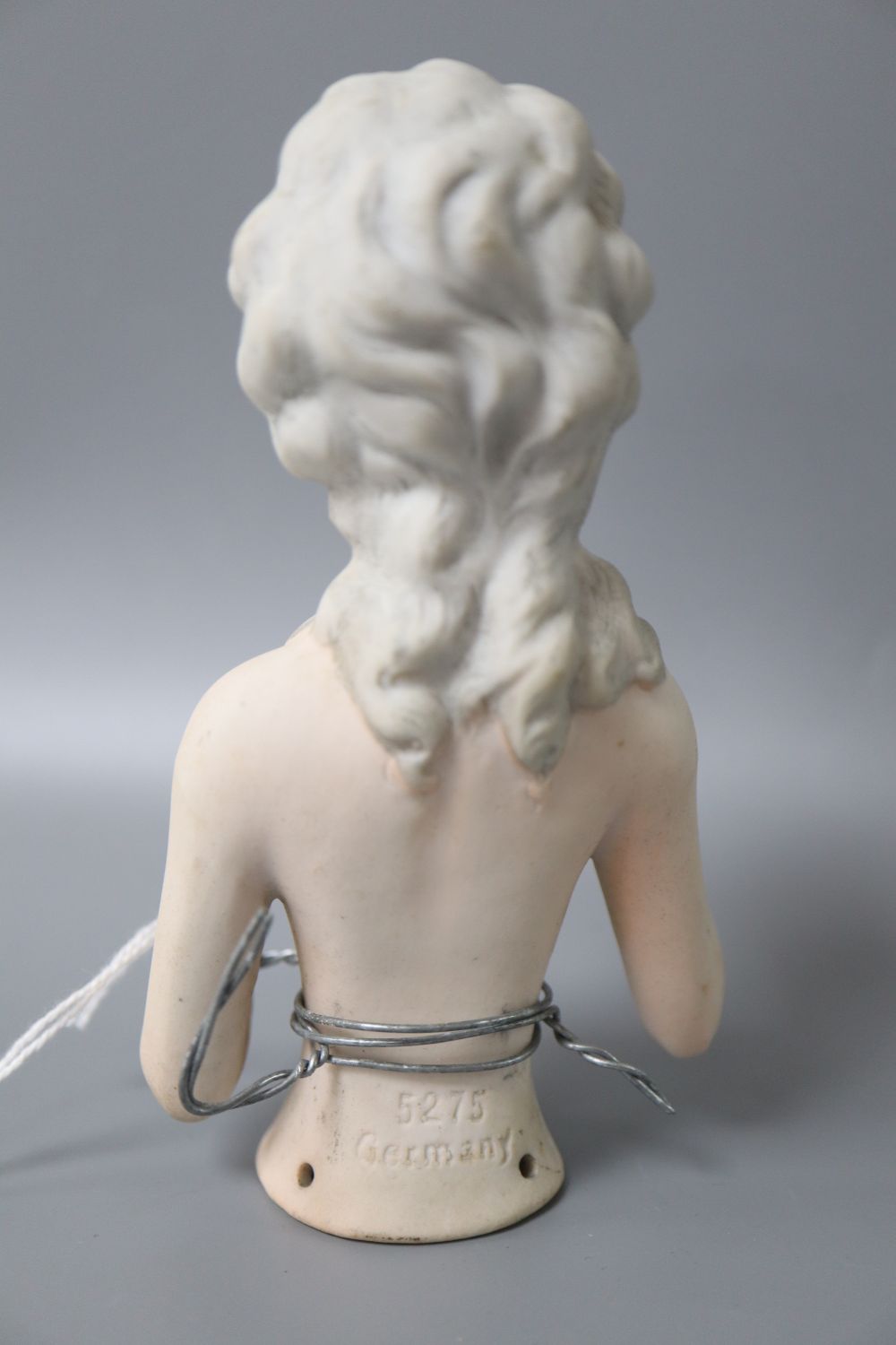 A 1920s bisque pin dolly